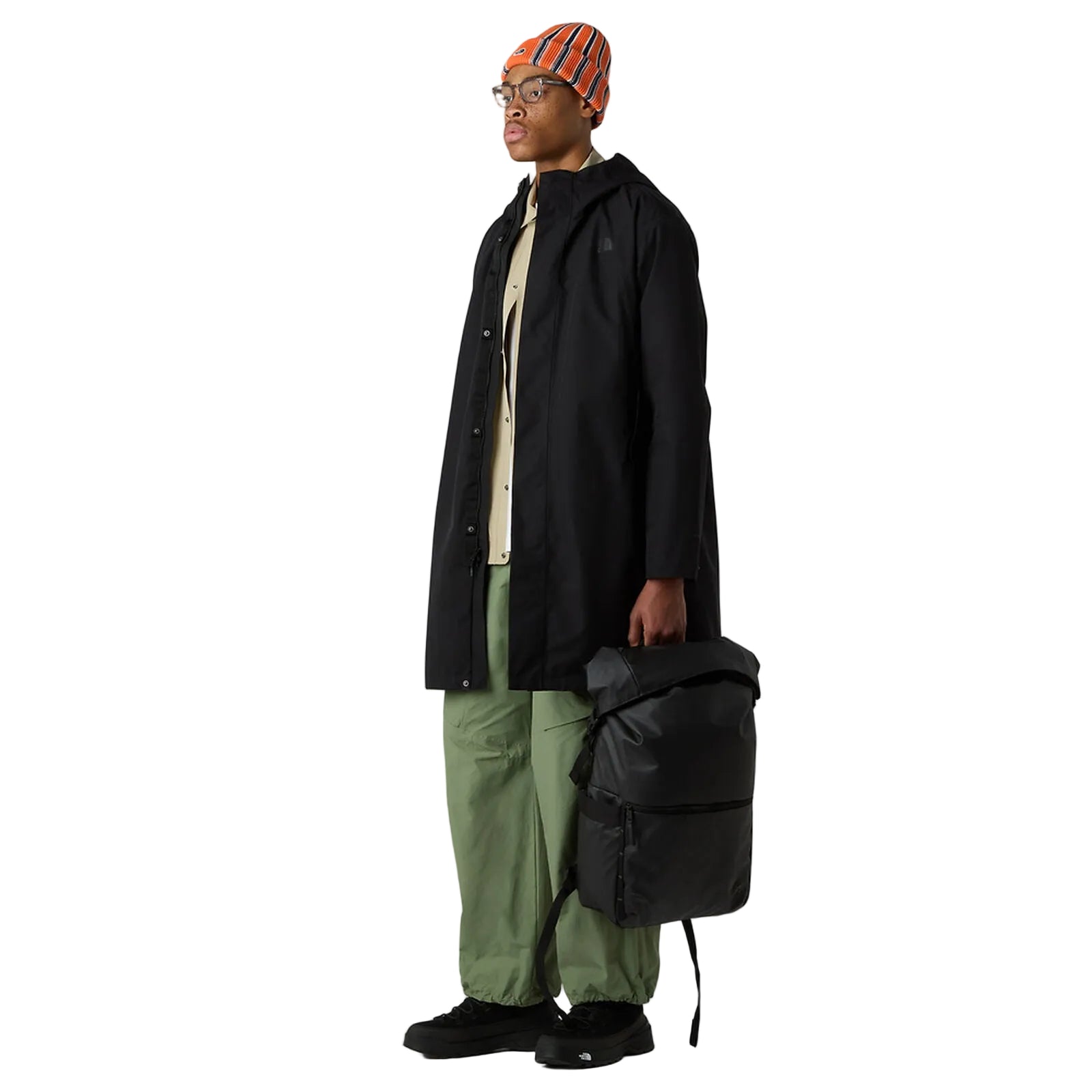 The North Face Base Camp Voyager Roll Top Backpack 25L in use for weekend travel, showing versatile storage capacity