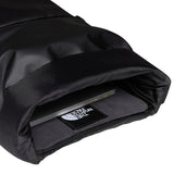 The North Face Base Camp Voyager Roll Top Backpack 25L being worn, demonstrating comfortable all-day carry