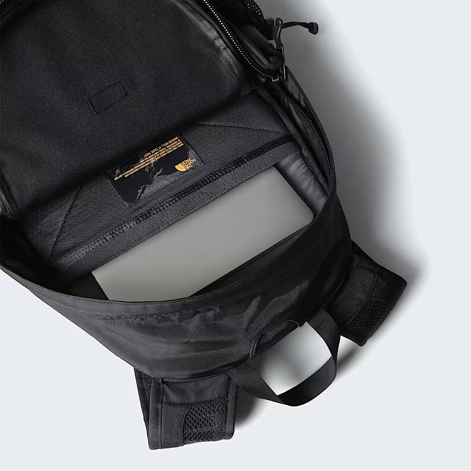 Detail shot of The North Face Hot Shot Base Camp Backpack showing daisy-chain webbing and reflective details
