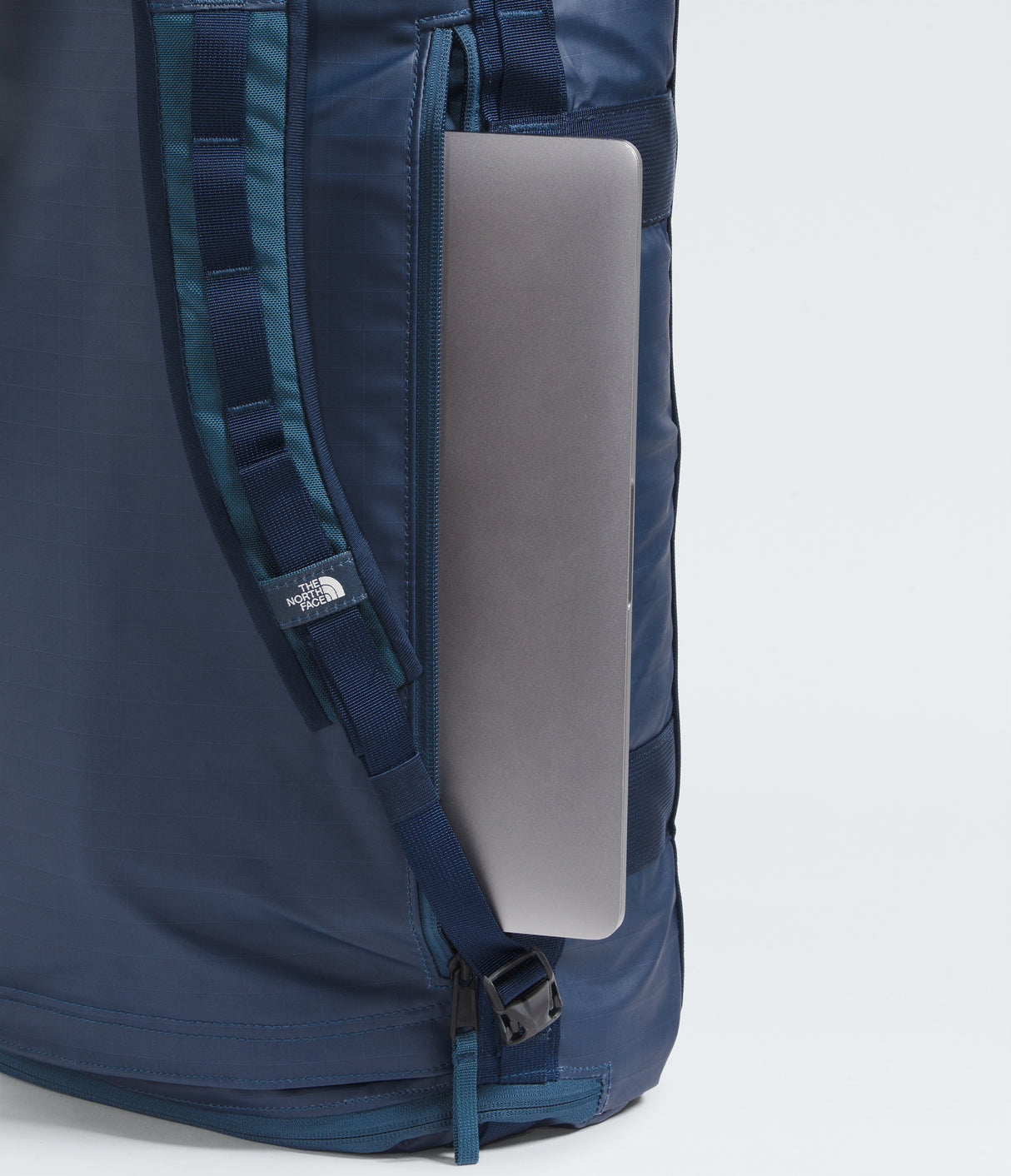 The North Face Voyager Duffel Backpack 32L Shady Blue/Summit Navy - external pocket and ID window close-up