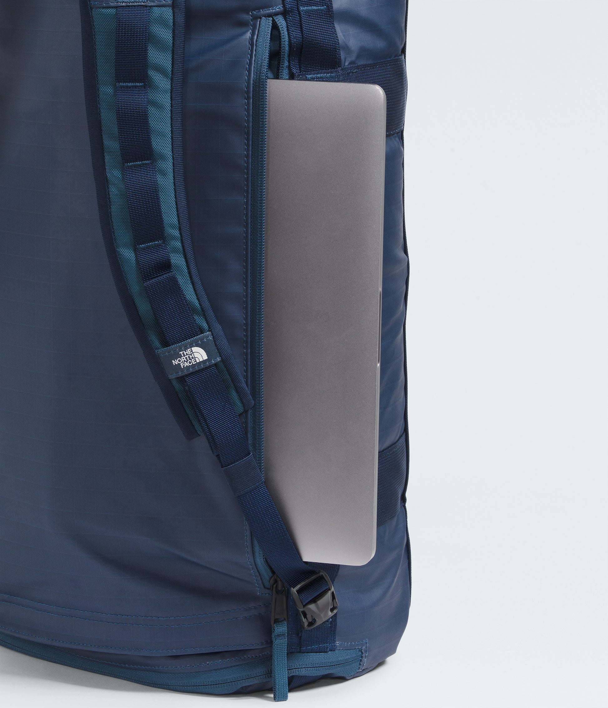 The North Face Voyager Duffel Backpack 32L Shady Blue/Summit Navy - external pocket and ID window close-up