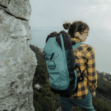 Wild Country Climbing Crag Hauler 25 Backpack Outdoor Action Black/Marsh - on models back up a mountain