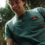 Wild Country Climbing Spotter T-Shirt Man Outdoor Action Marsh - Product In Use close up of logo