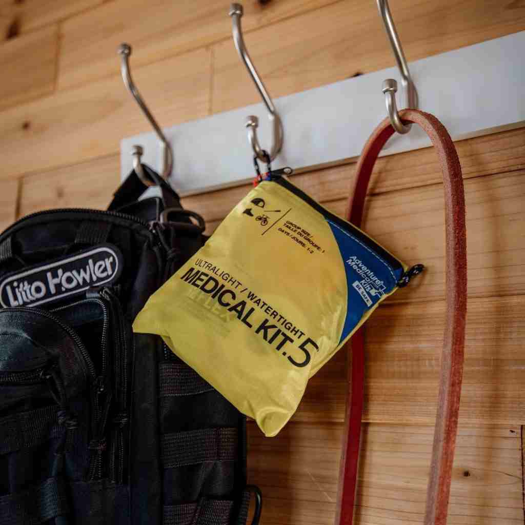 Adventure Medical Kits Ultralight Watertight .5 First Aid Kit attached to a backpack