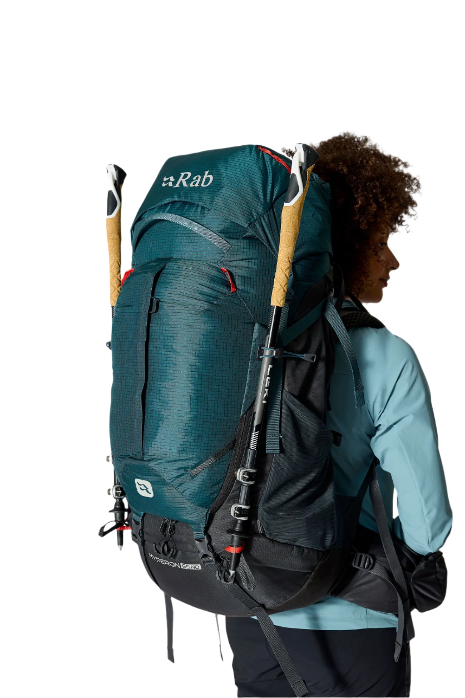 Rab Women's Hyperon ND65L Trekking Pack in Orion Blue/Anthracite - rear three-quarter with trekking poles, worn