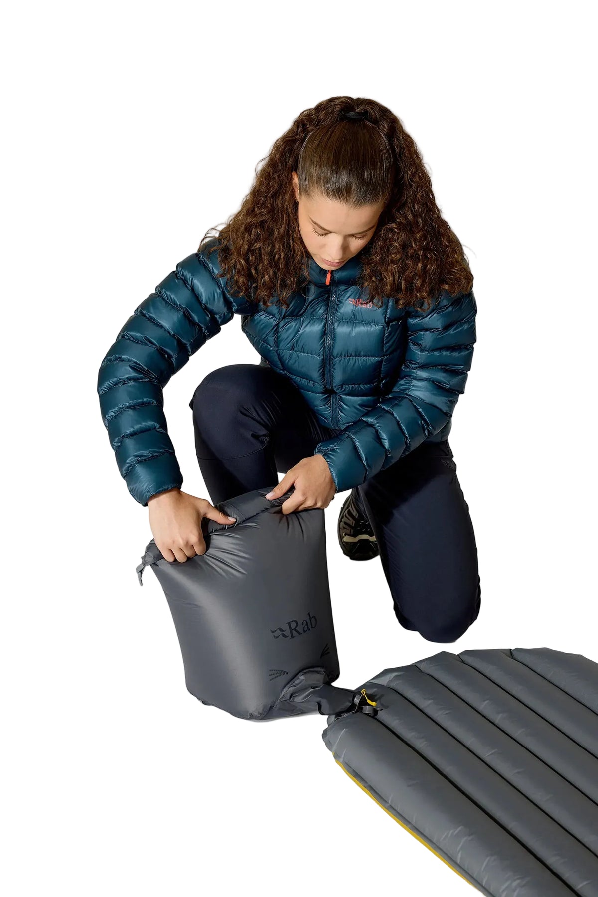 Rab Ionosphere 5 Sleep Mat in Dark Pollen - pump sack, worn, angle