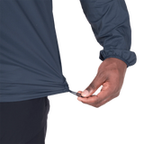 Zipped chest pocket detail on Mountain Equipment Aerofoil Hooded Men's Jacket in Blue Nights doubling as stuff sack with twin karabiner carry loops