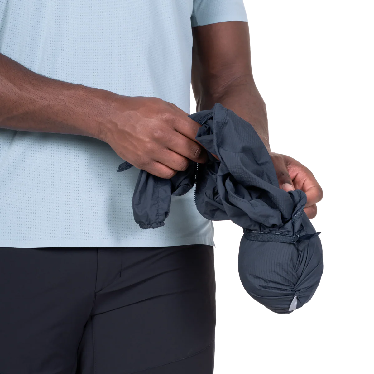 Mountain Equipment Aerofoil Hooded Men's Jacket in Blue Nights - packed into chest pocket showing twin karabiner carry loops