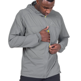 Zipped chest pocket detail on Mountain Equipment Aerofoil Hooded Men's Jacket in Tufa doubling as stuff sack with twin karabiner carry loops