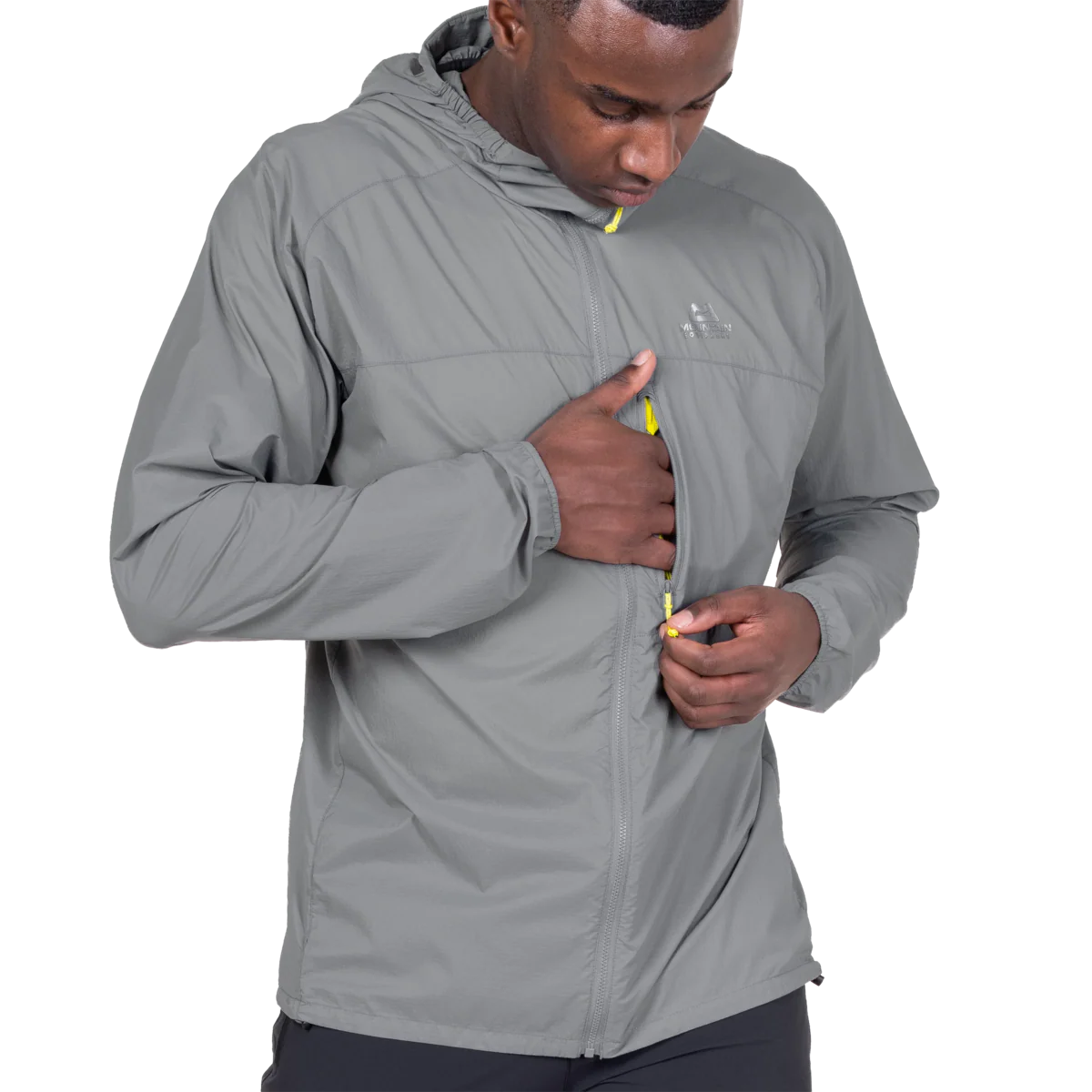 Zipped chest pocket detail on Mountain Equipment Aerofoil Hooded Men's Jacket in Tufa doubling as stuff sack with twin karabiner carry loops