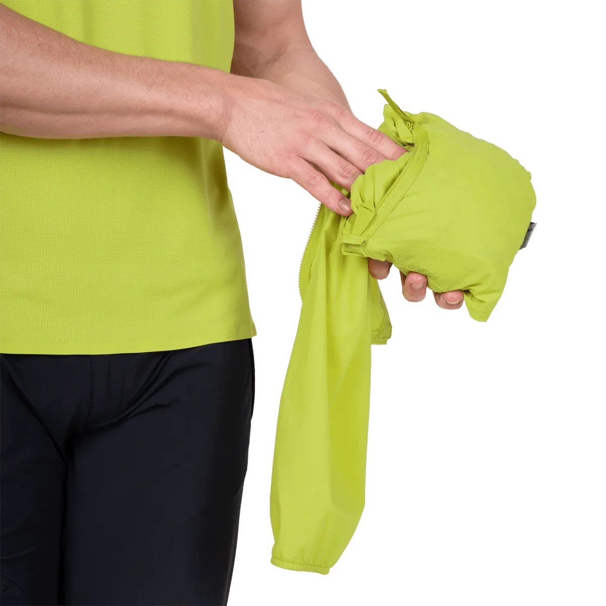 Adjustable hem drawcord detail on Mountain Equipment Aerofoil Hooded Men's Jacket in Vine Green for use under a harness or rucksack waistbelt