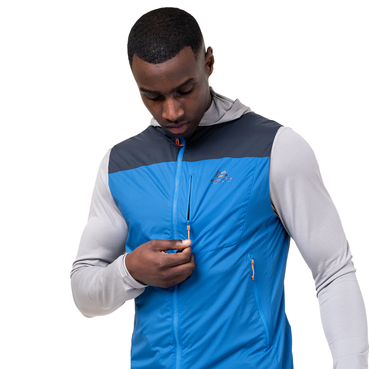 Zipped chest pocket detail on Mountain Equipment Aerotherm Men's Vest in Atlantic/Blue Nights doubling as stuff sack with twin karabiner carry loops