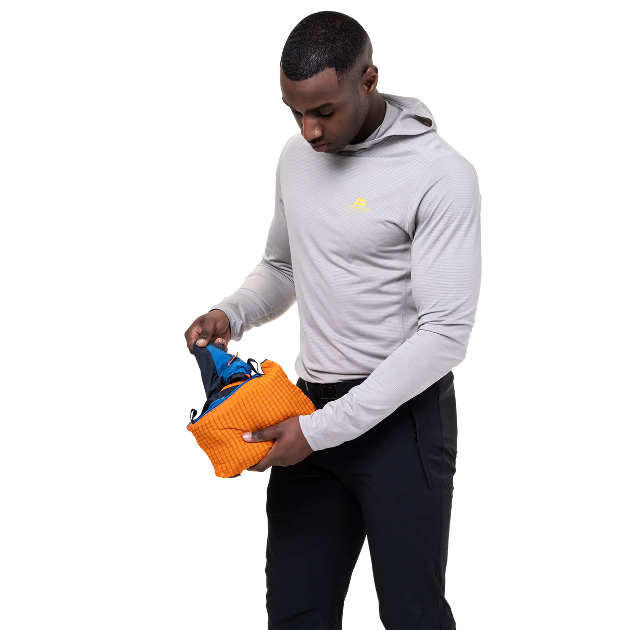 Mountain Equipment Aerotherm Men's Vest in Atlantic/Blue Nights - packed into hand pocket showing twin karabiner carry loops