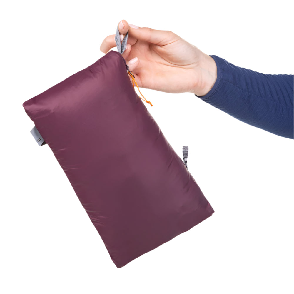Mountain Equipment Earthrise Women's Jacket in Raisin packed into hand pocket showing twin karabiner carry loops