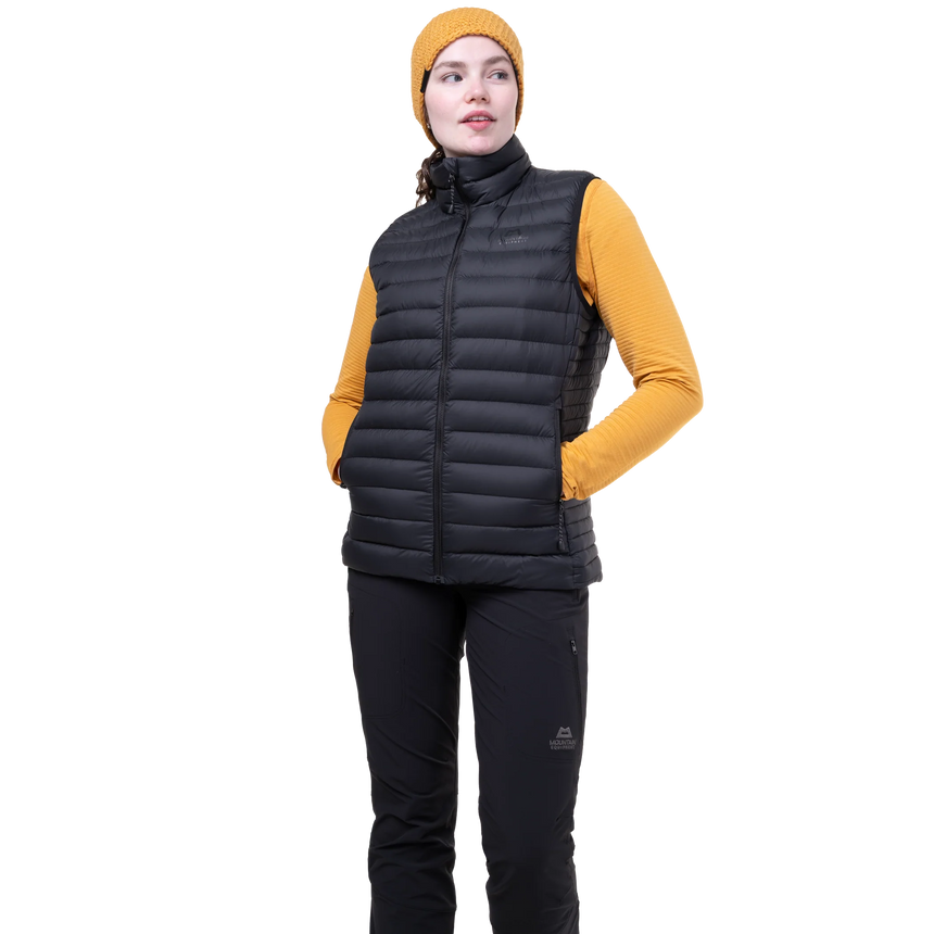 Mountain Equipment Earthrise Women's Vest in Black - side view showing fit and dual tether hem drawcords