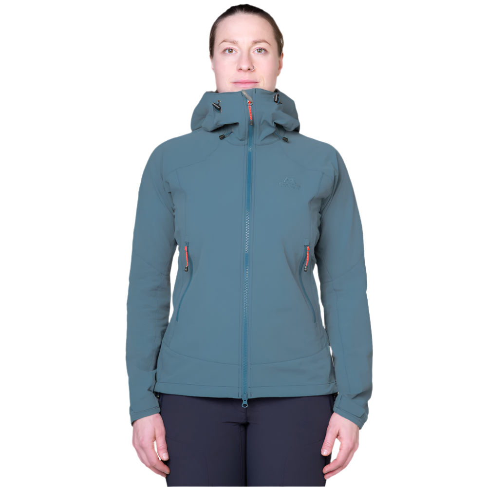 Zipped hand pocket detail on Mountain Equipment Frontier Women's Jacket in Indian Teal positioned high for harness compatibility