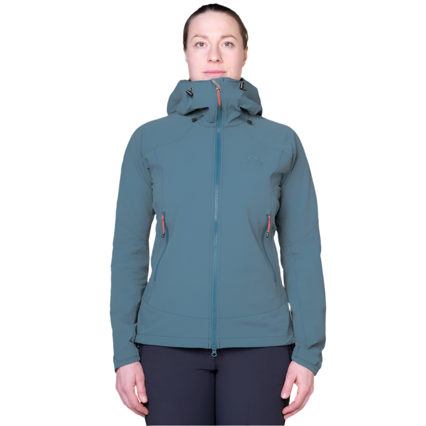 Zipped hand pocket detail on Mountain Equipment Frontier Women's Jacket in Indian Teal positioned high for harness compatibility