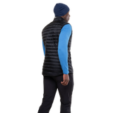 Mountain Equipment Frostline Men's Vest in Black worn on model - angled back view showing DRILITE Loft 20D shell and elastane-bound armholes