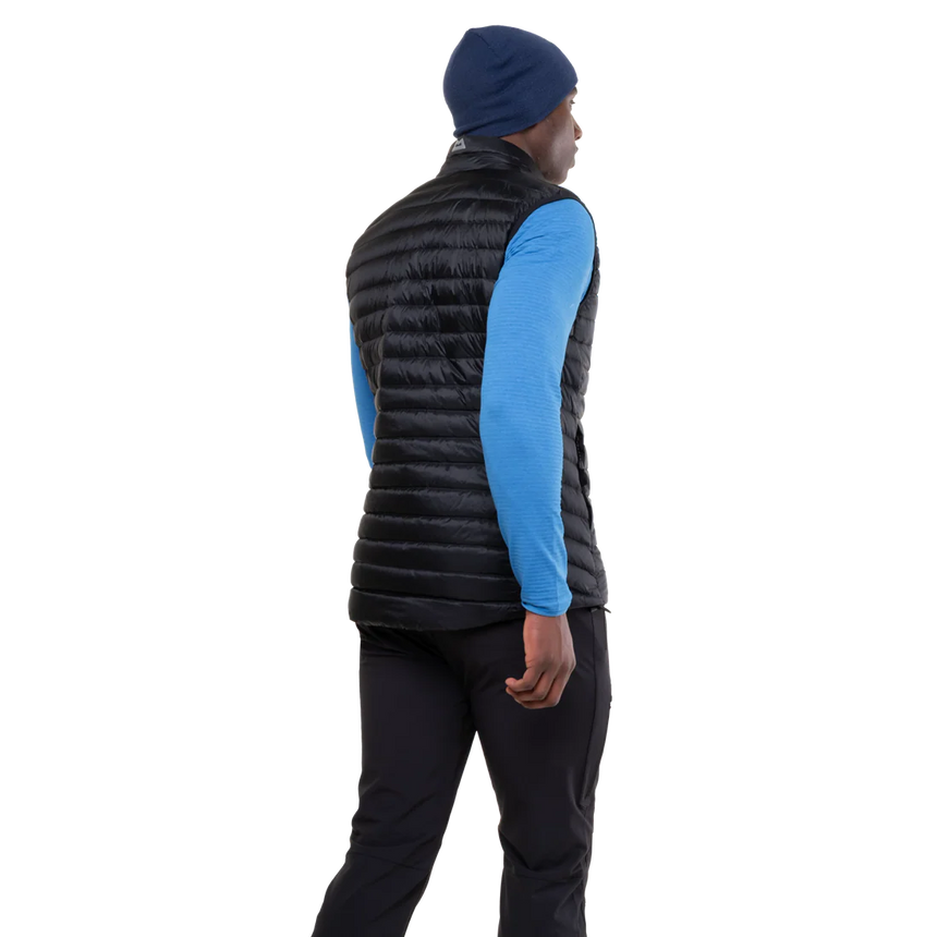 Mountain Equipment Frostline Men's Vest in Black worn on model - angled back view showing DRILITE Loft 20D shell and elastane-bound armholes