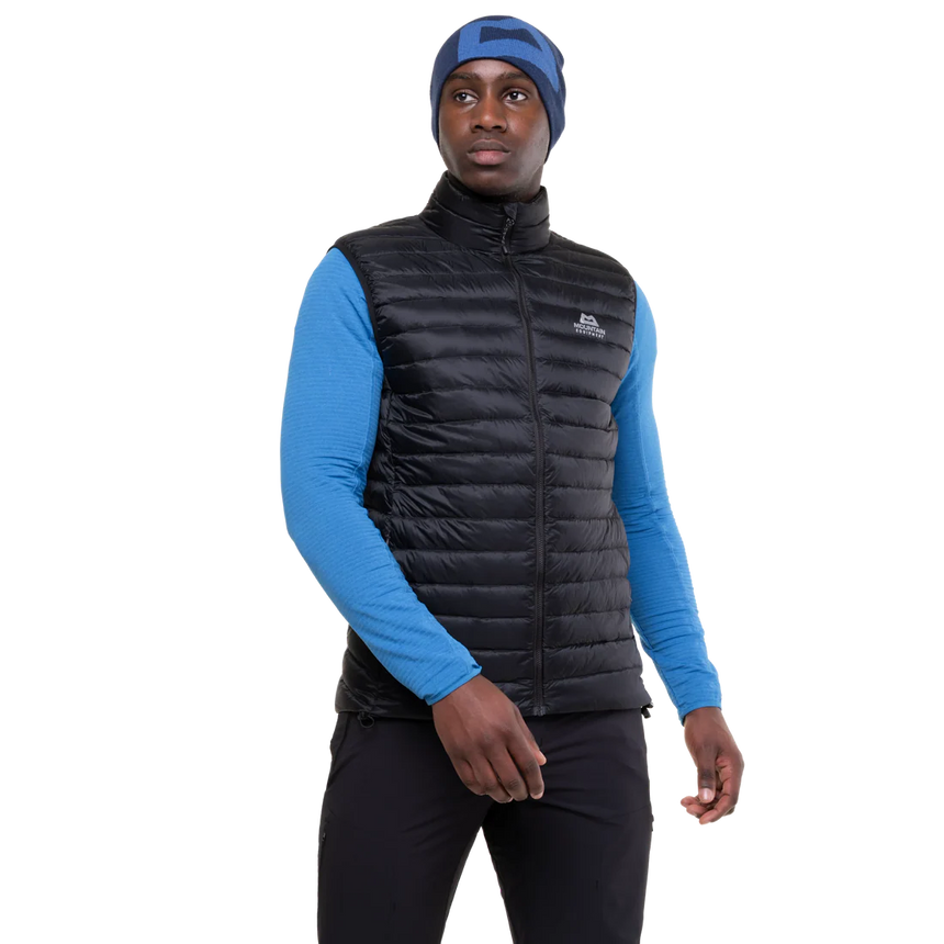 Mountain Equipment Frostline Men's Vest in Black worn on model - front view showing YKK front zip with insulated baffle and zipped hand warmer pockets