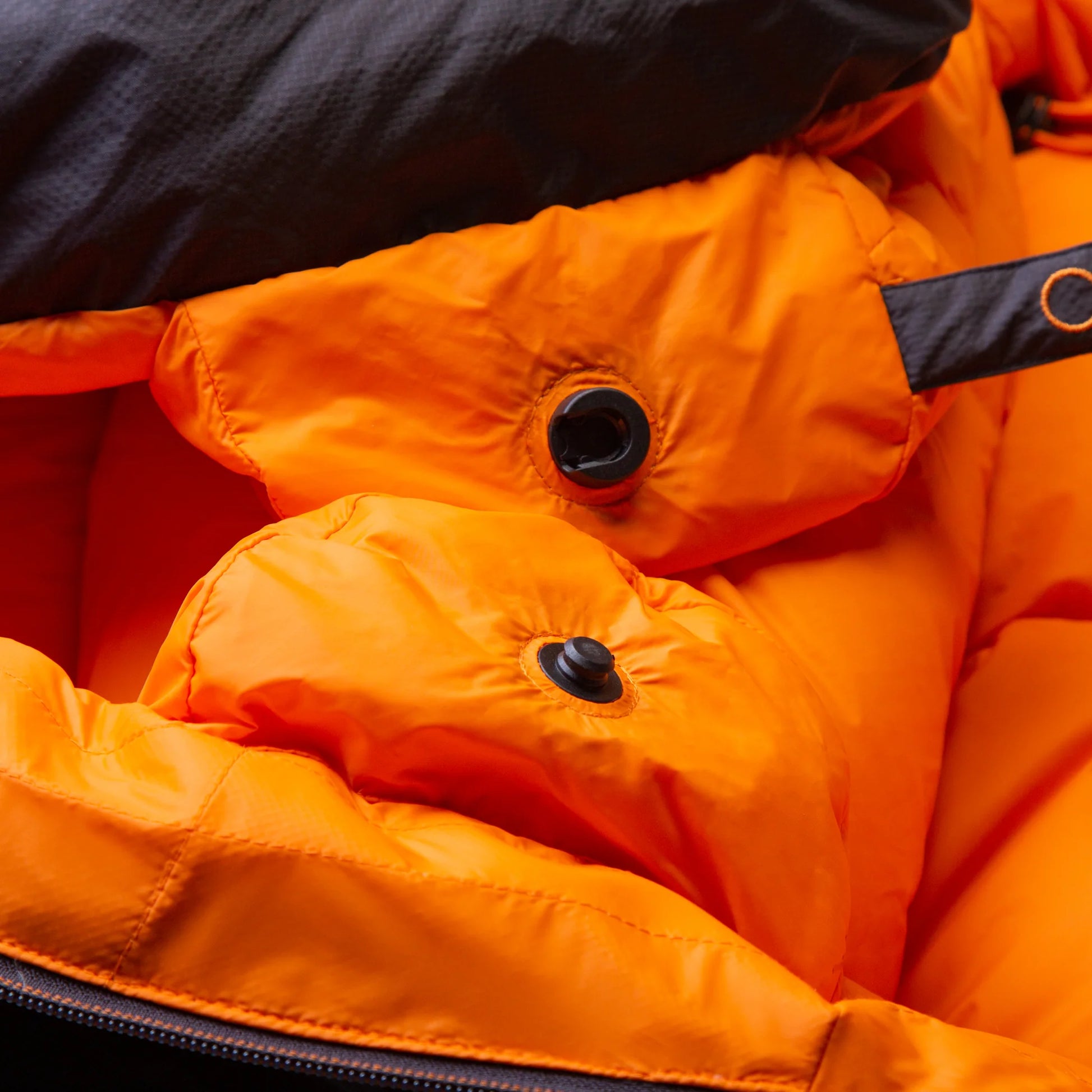 5-baffle hood with Lode Lock magnetic closure and collar drawcords detail on Mountain Equipment Glacier 300 Sleeping Bag in Obsidian
