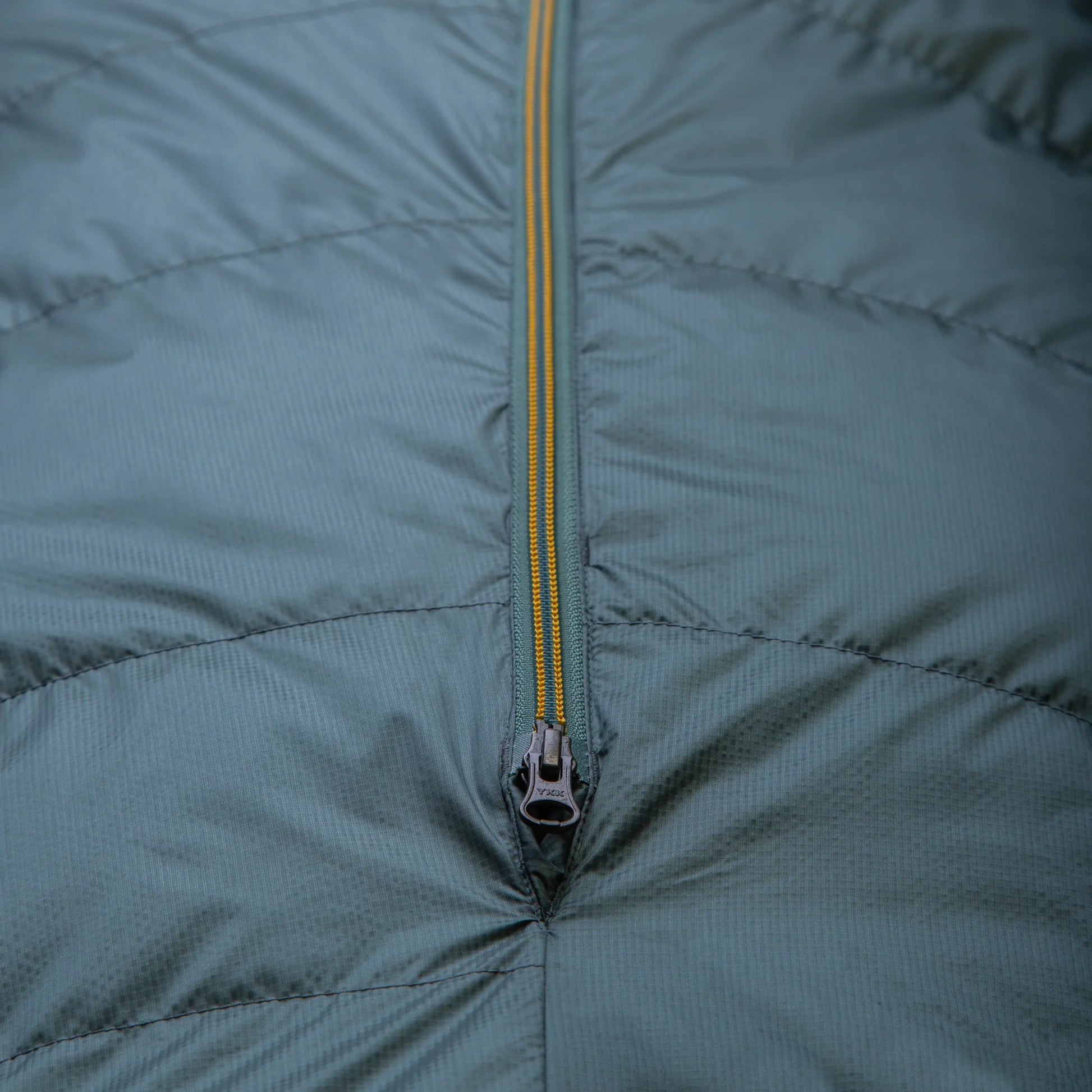 Mountain Equipment Glacier 450 Women's Sleeping Bag in Sage packed into waterproof roll-top stuff sack