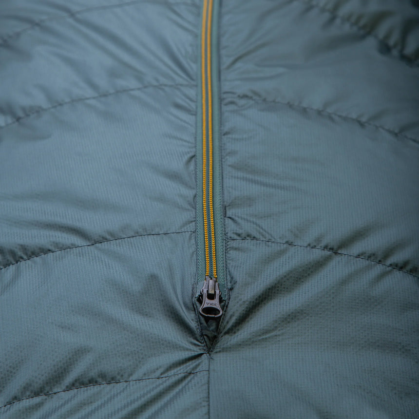 Mountain Equipment Glacier 450 Women's Sleeping Bag in Sage packed into waterproof roll-top stuff sack