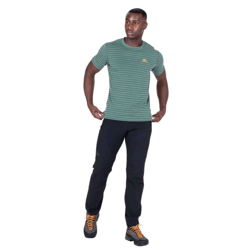 Mountain Equipment Groundup Men's Tee in Fern Stripe - lifestyle view showing lightweight technical tee for rock climbing on hot days