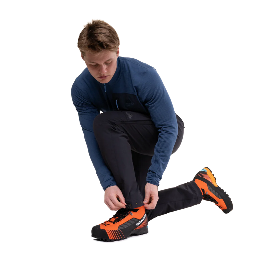 Adjustable waistband with metal button closure and belt loops on Mountain Equipment Ibex Pro Men's Pant in Black