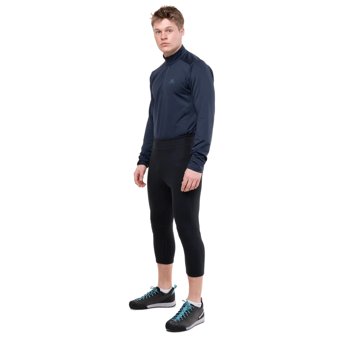 Mountain Equipment Jorasses Lite Men's 3/4 Tight in Black - lifestyle view showing fleece ski tight for cold mountain conditions