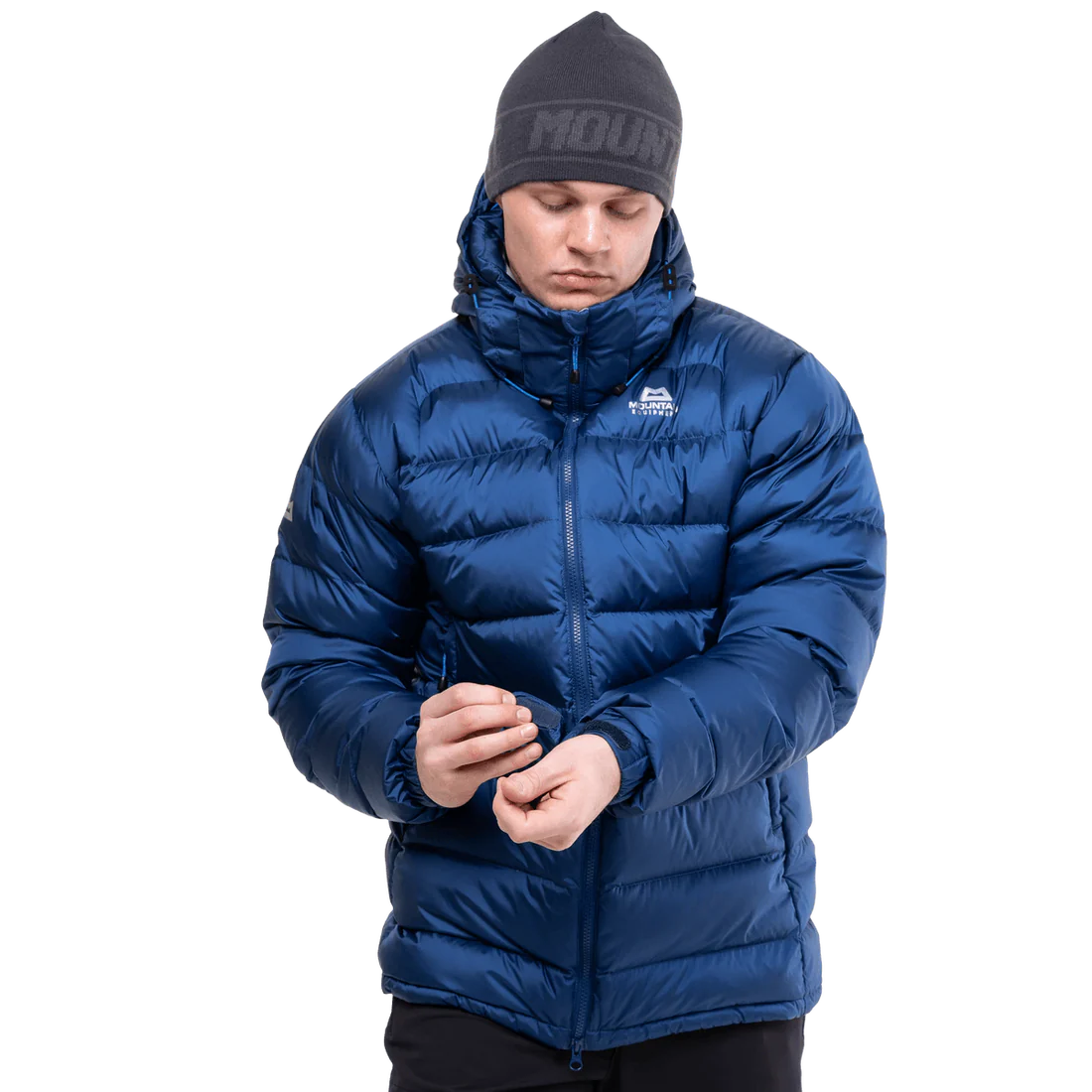 Stitch-through baffle construction detail on Mountain Equipment Lightline Men's Jacket in Admiral Blue showing 700 fill power down insulation