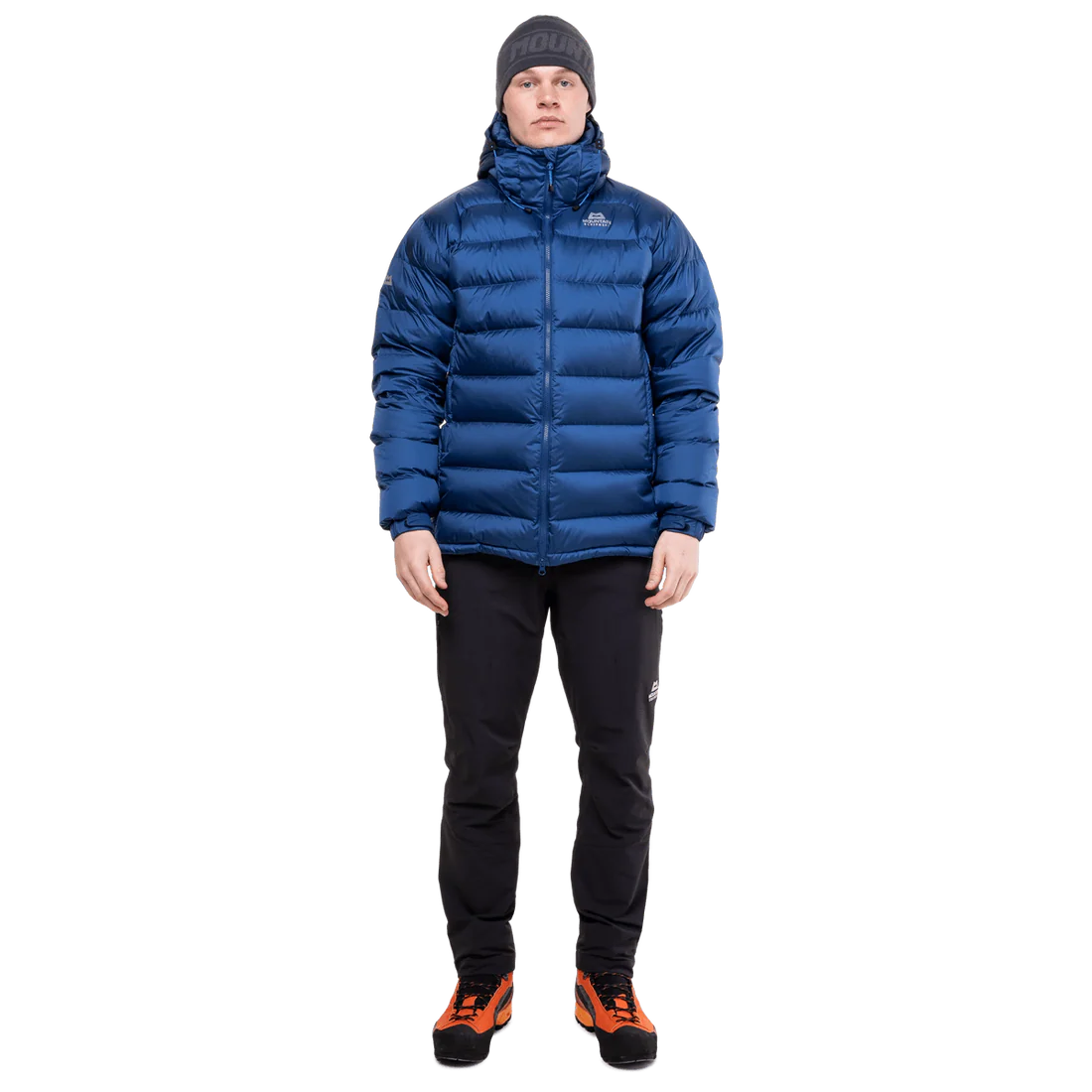 Mountain Equipment Lightline Men's Jacket in Admiral Blue - lifestyle view showing technical duvet jacket for mountaineering in sub-zero conditions