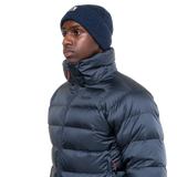 Stitch-through baffle construction detail on Mountain Equipment Lightline Men's Jacket in Blue Nights/Cosmos showing 700 fill power down insulation