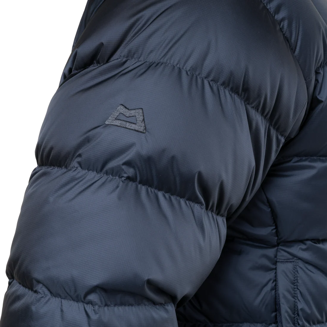 Mountain Equipment Lightline Men's Jacket in Blue Nights/Cosmos - lifestyle view showing iconic benchmark down jacket for cold weather alpine use