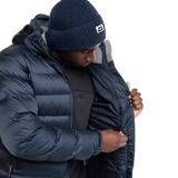 Mountain Equipment Lightline Men's Jacket in Blue Nights/Cosmos packed into stuff sack showing lightweight packable construction