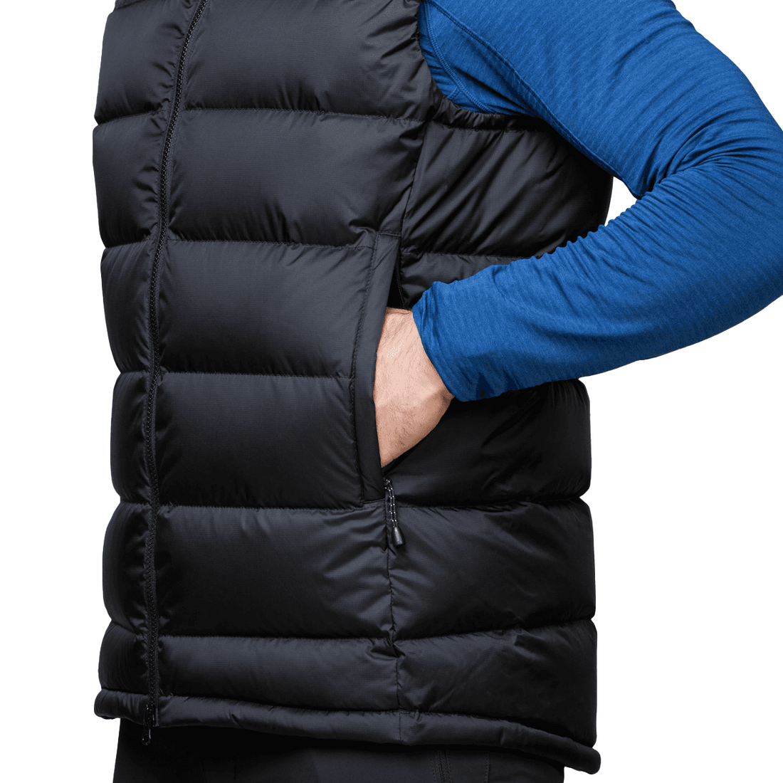 Mountain Equipment Lightline Men's Vest in Black - detail view showing zipped hand warmer pocket and Drilite Loft windproof outer fabric