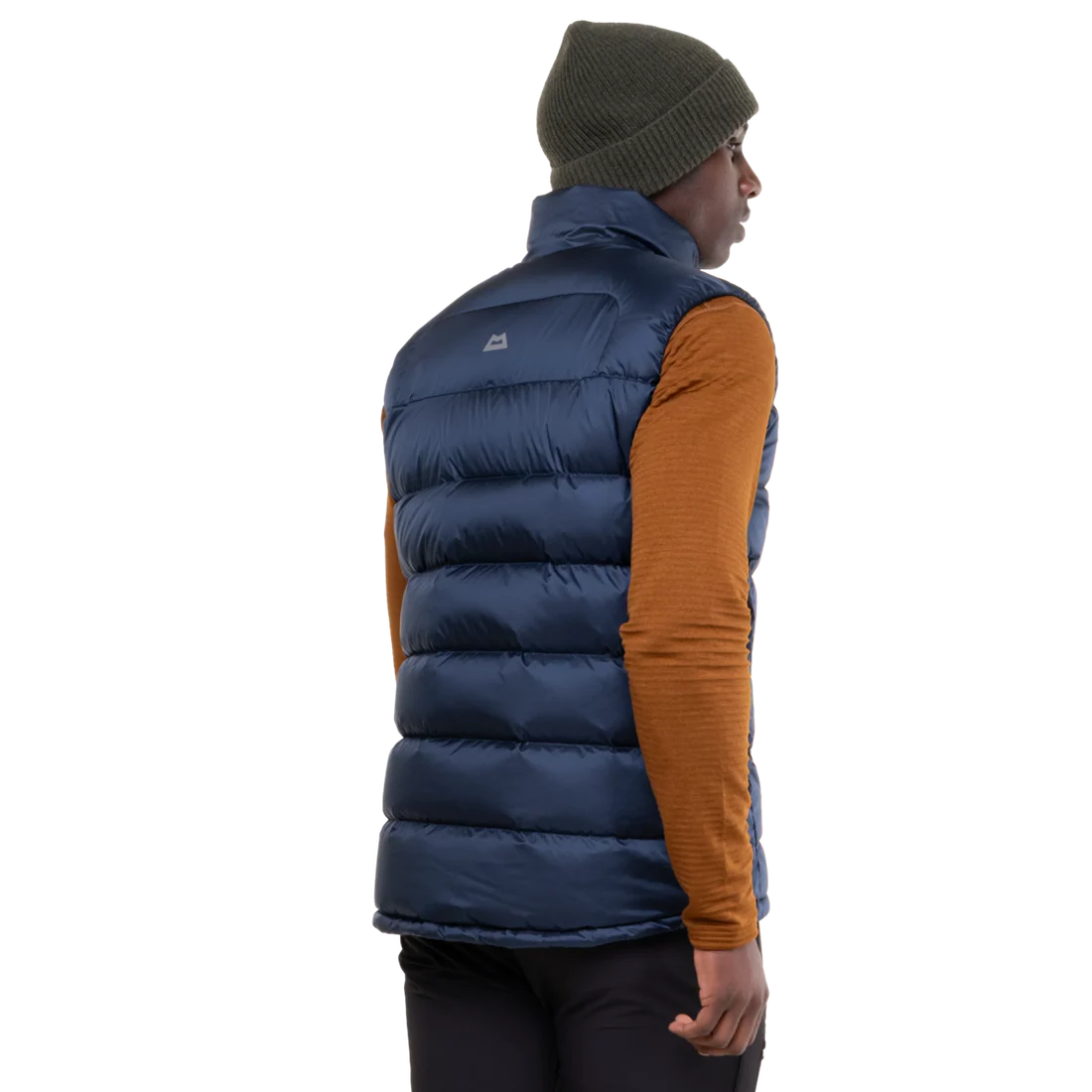 Mountain Equipment Lightline Men's Vest in Navy - lifestyle view showing super warm down vest for mountaineering and cold weather use