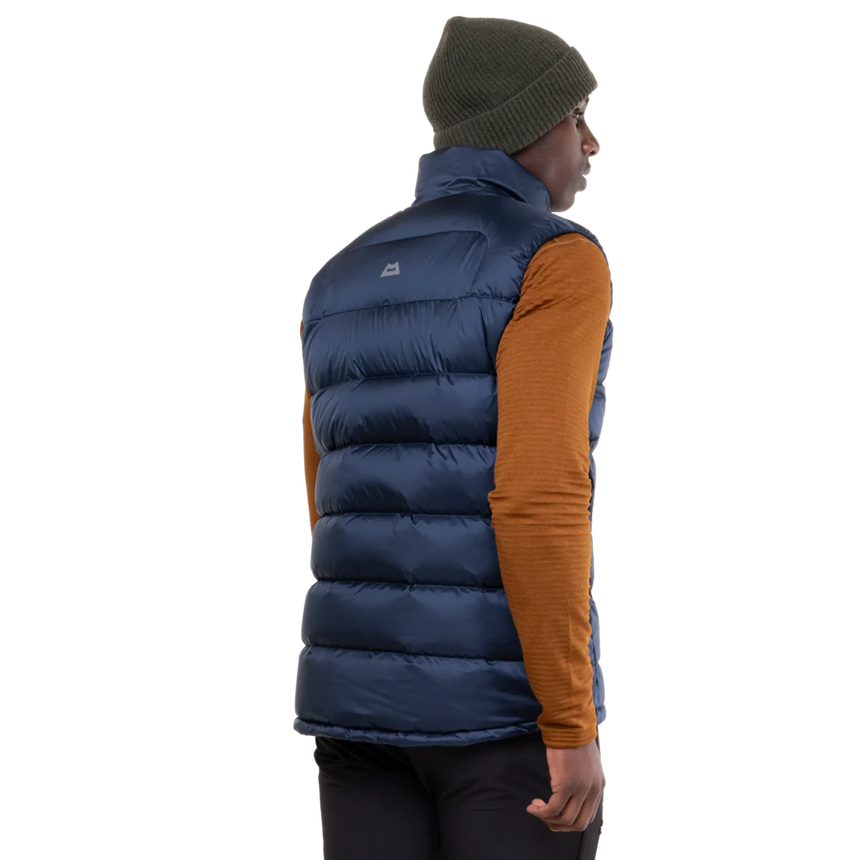 Mountain Equipment Lightline Men's Vest in Navy - lifestyle view showing super warm down vest for mountaineering and cold weather use