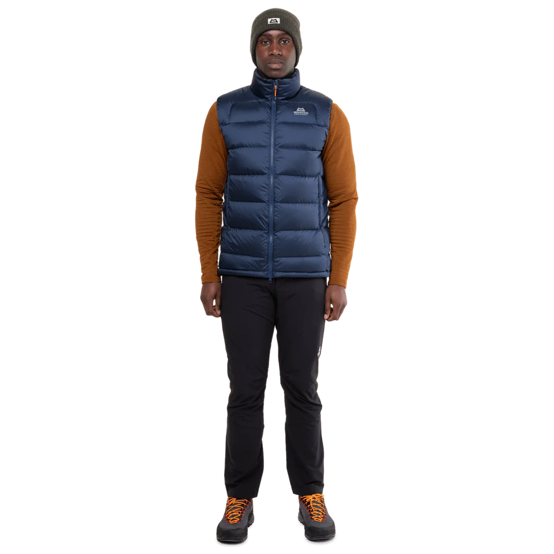 Mountain Equipment Lightline Men's Vest in Navy packed into internal pocket showing lightweight packable construction