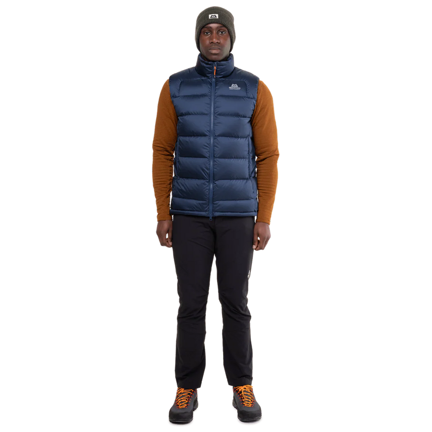 Mountain Equipment Lightline Men's Vest in Navy packed into internal pocket showing lightweight packable construction