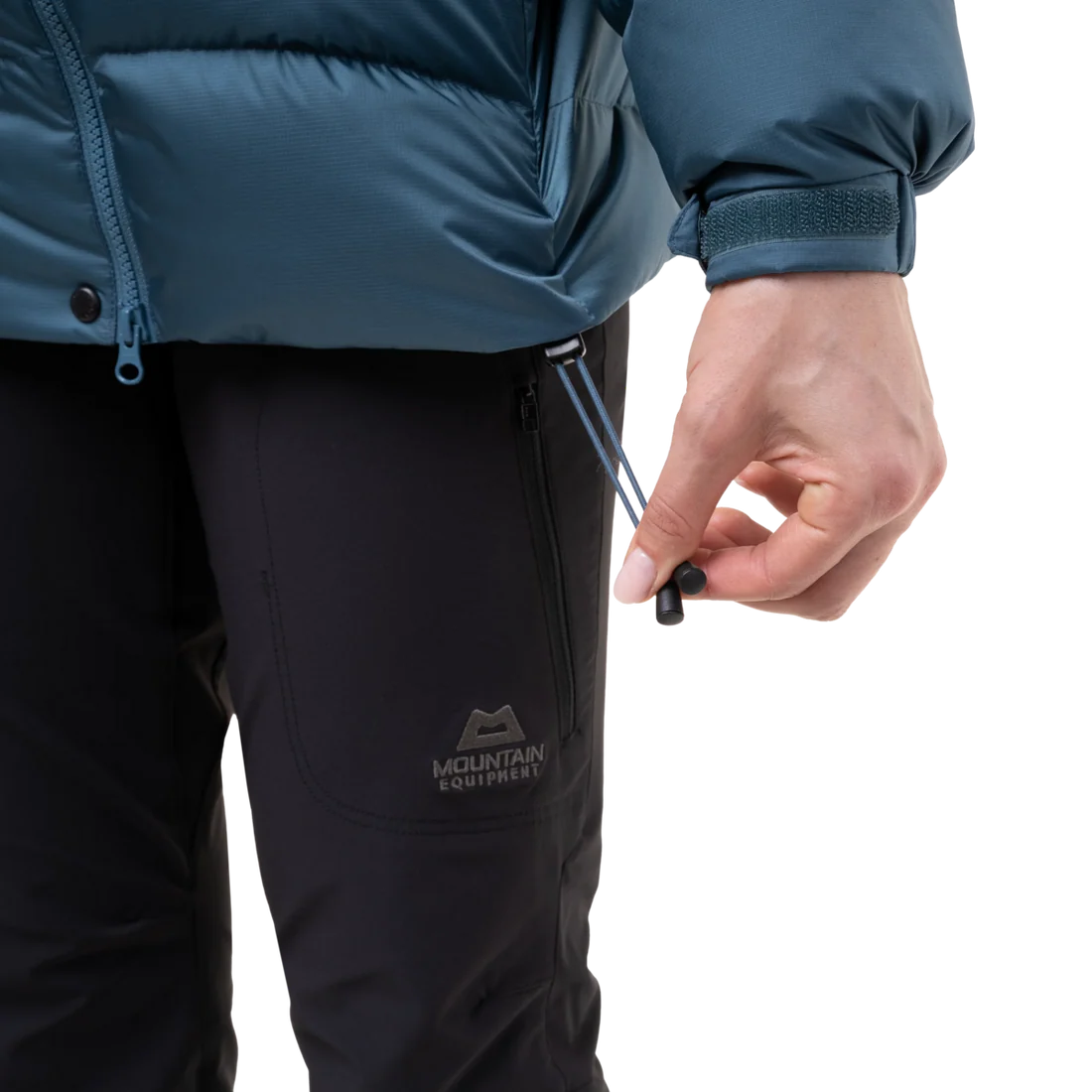 Mountain Equipment Lightline Women's Jacket in Stellar Blue - lifestyle view showing technical duvet jacket for mountaineering in sub-zero conditions