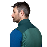 Mountain Equipment Switch Men's Vest in Pine/Fern - detail view showing zipped hand pocket positioned for use with a harness or rucksack waistbelt