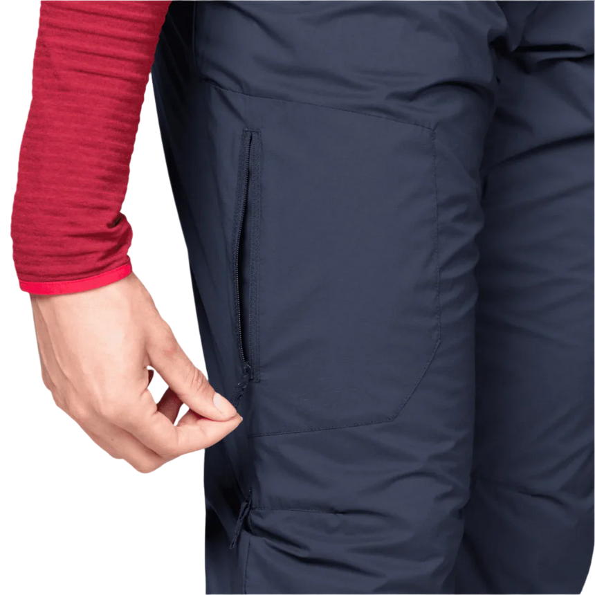 Mountain Equipment Switch Women's Pant in Cosmos - lifestyle view showing fast drying windproof insulated legwear for cold weather mountaineering