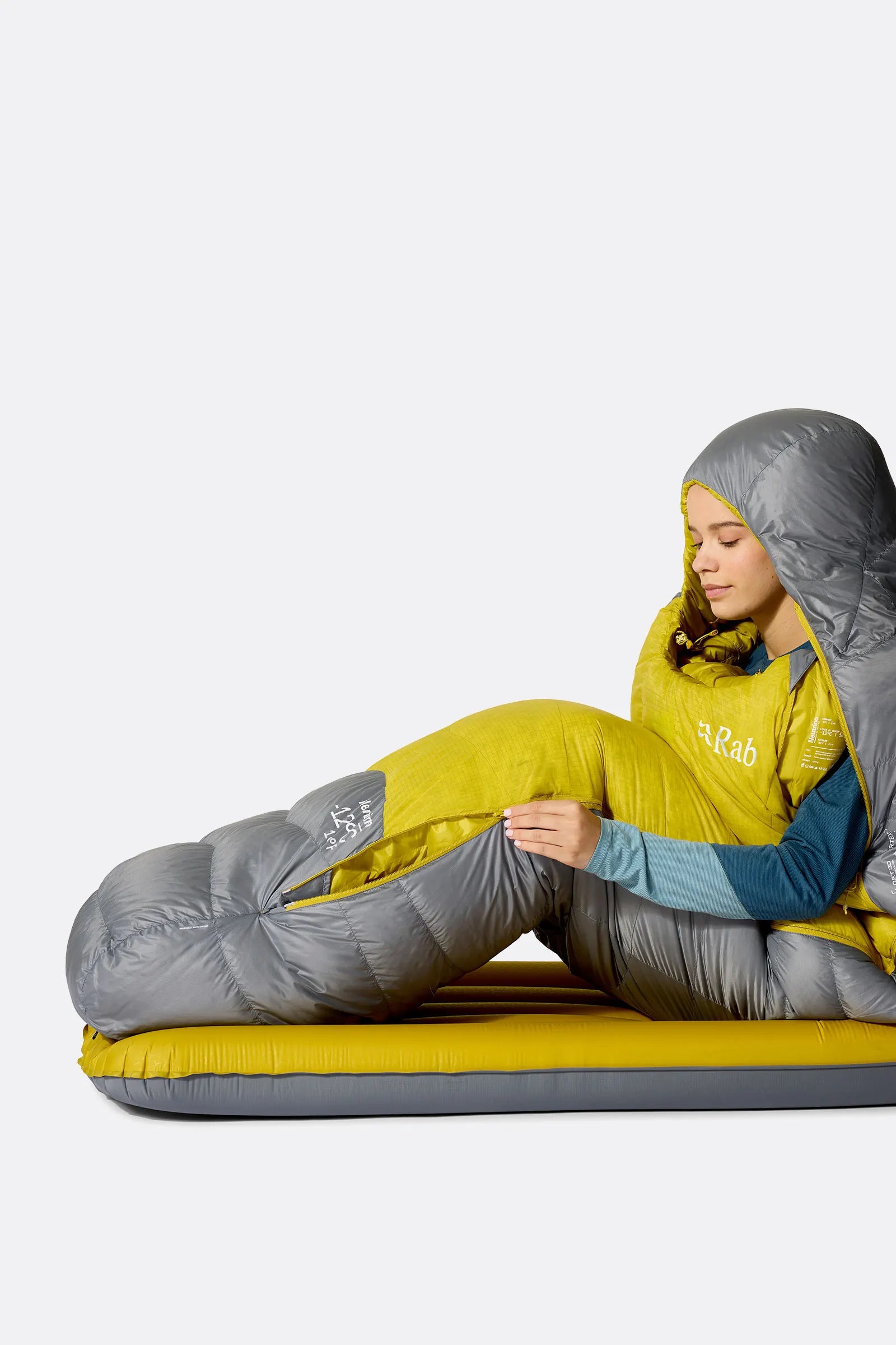 Rab Women's Neutrino Down Sleeping Bag in Zinc/Dark Pollen - worn