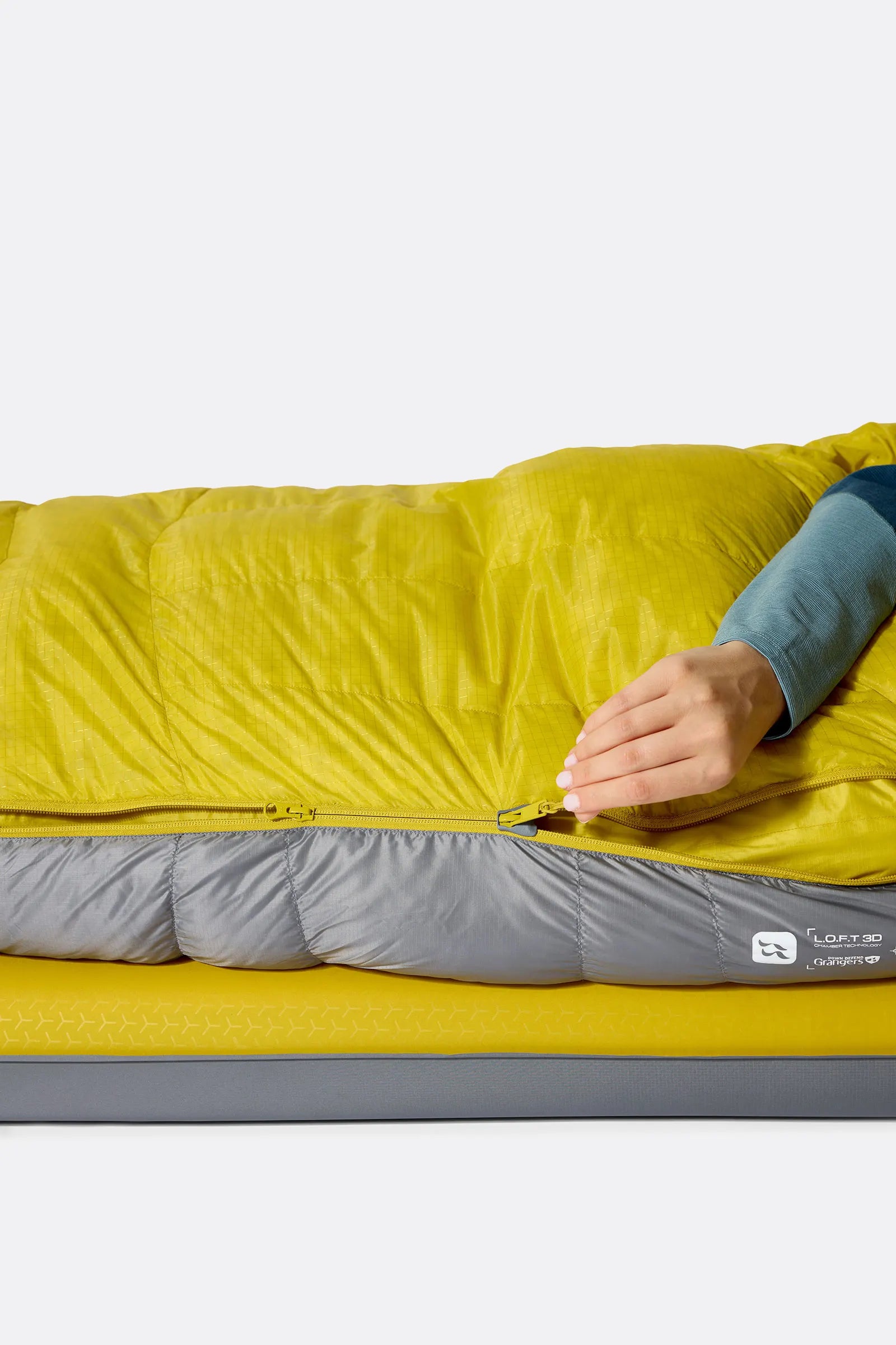Rab Women's Neutrino Down Sleeping Bag in Zinc/Dark Pollen - zip baffle detail