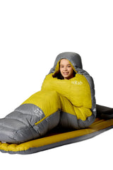 Rab Women's Neutrino Down Sleeping Bag in Zinc/Dark Pollen - worn lifestyle