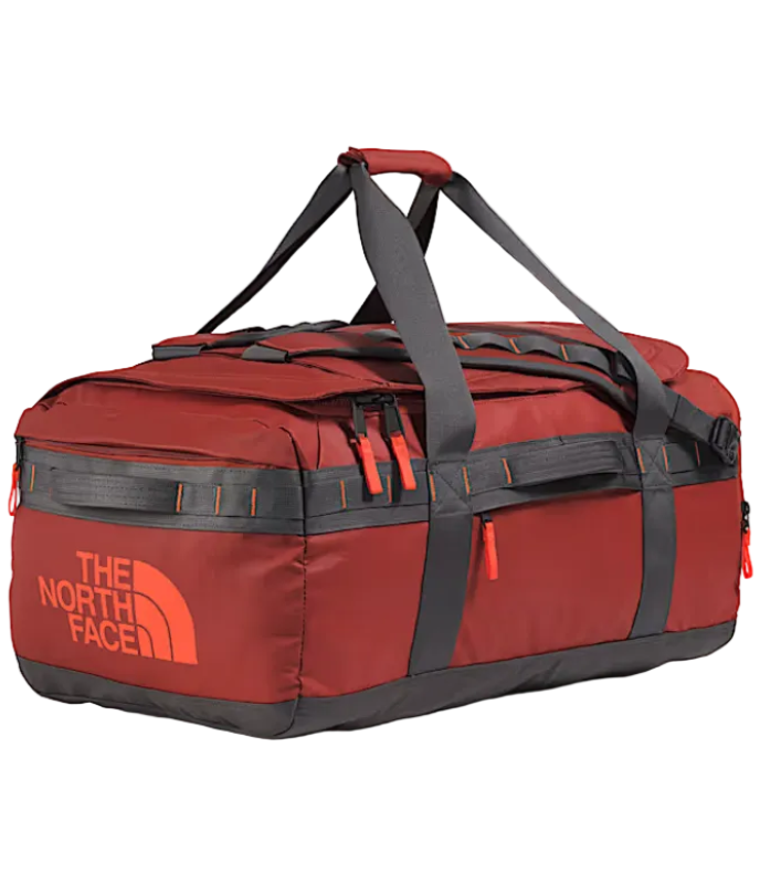 The North Face Base Camp Voyager Duffel 62L in Iron Clay/Anthracite Grey/Lava Red - front view showing recycled fabric construction and external zip pocket