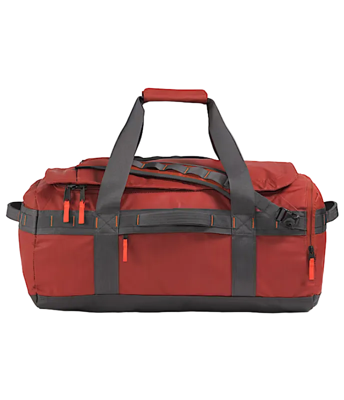 The North Face Base Camp Voyager Duffel 62L Iron Clay/Anthracite Grey/Lava Red - side view with detachable padded shoulder straps and grab handles