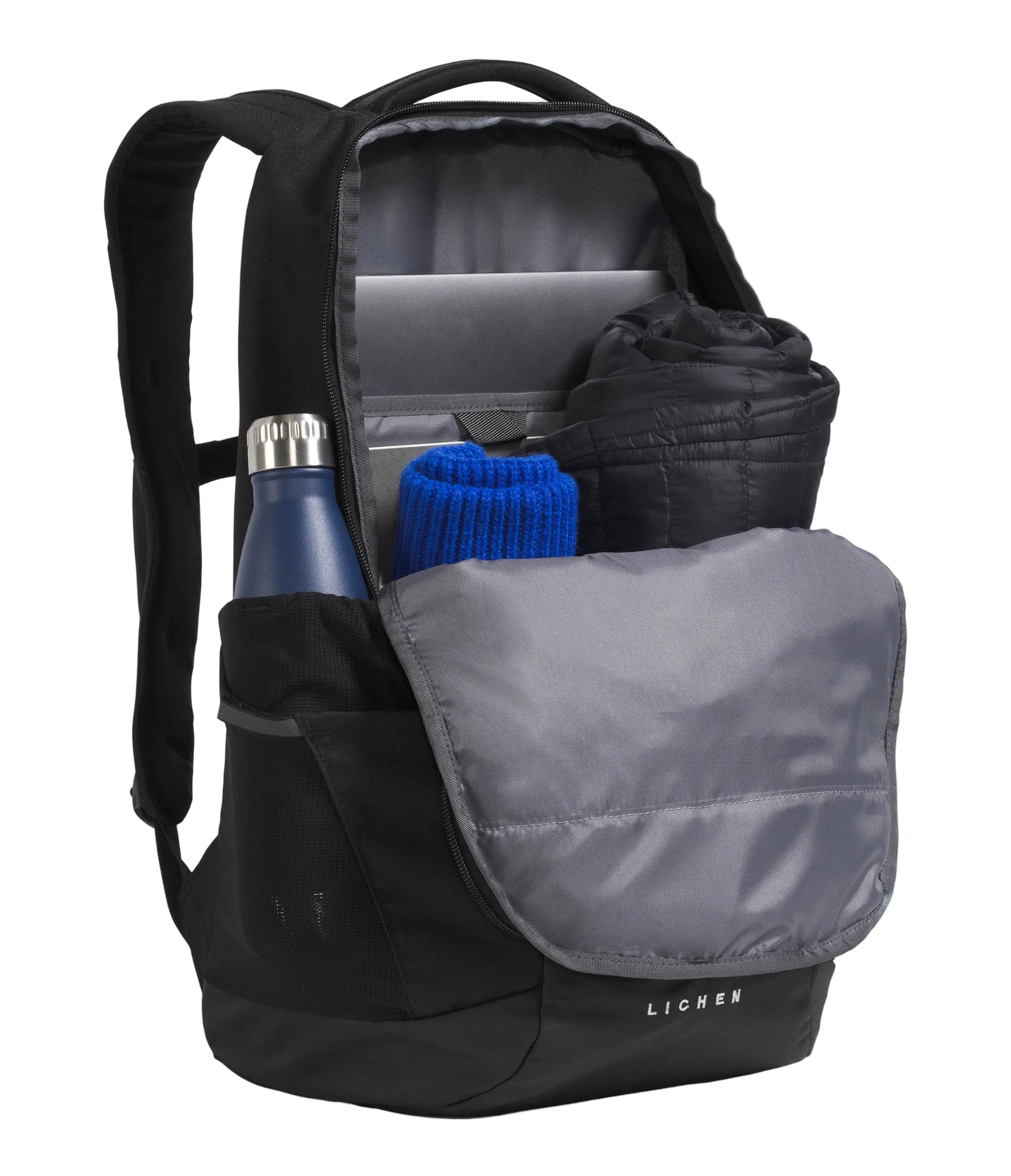The North Face Lichen Daypack 28L - front pocket open showing internal secure-zip mesh pocket and organisation pockets