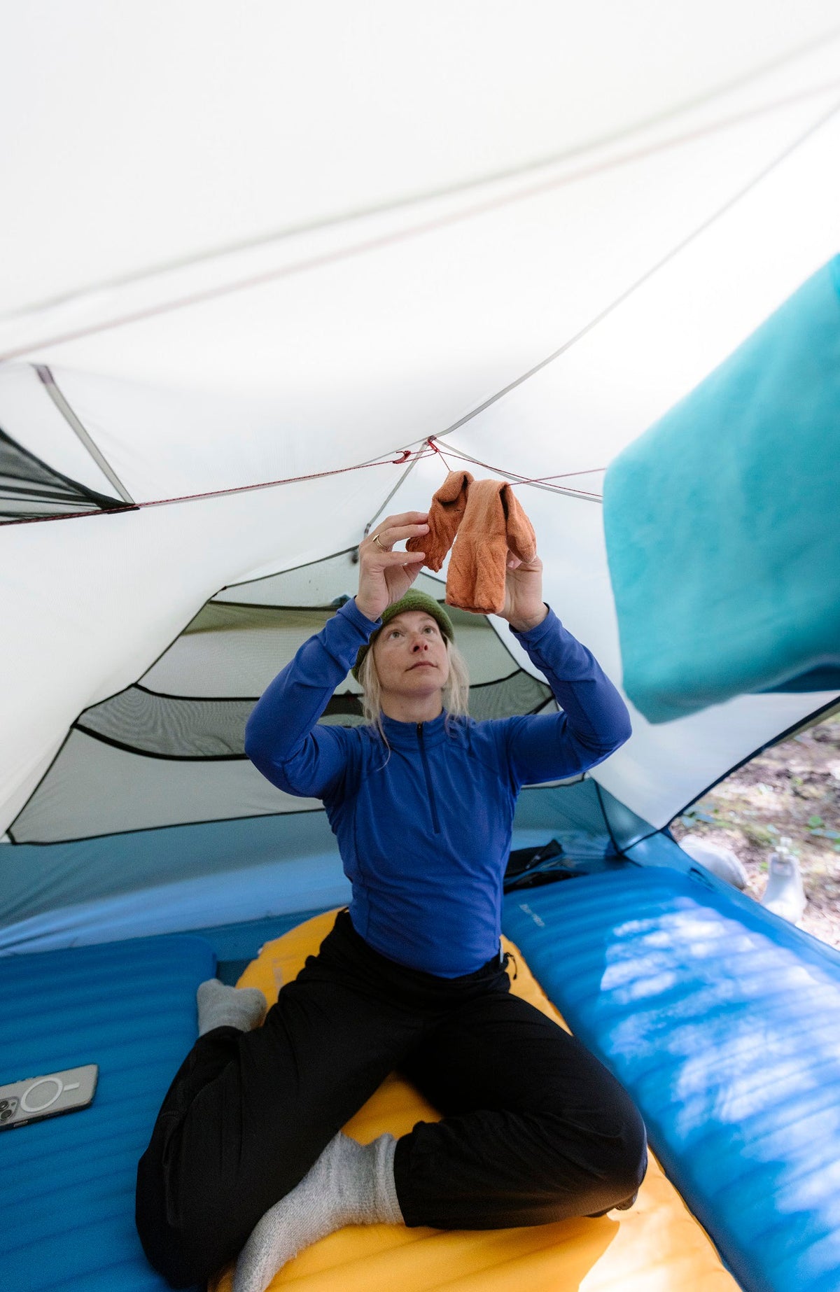 Therm-a-Rest Trail ProLite Sleeping Pad in Mango, in use, tent